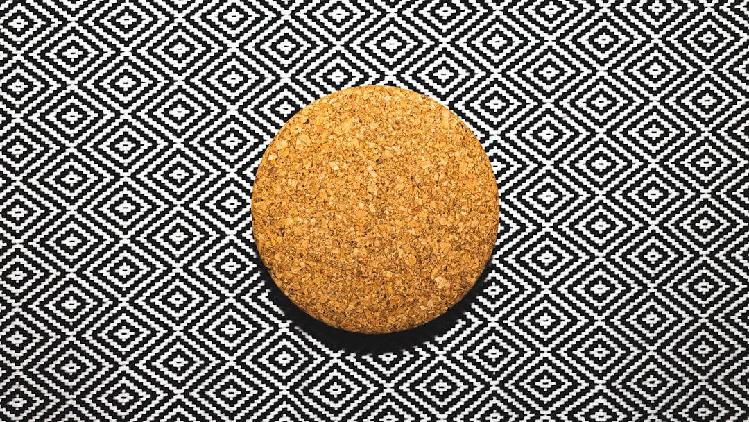 round brown round food on black and white textile